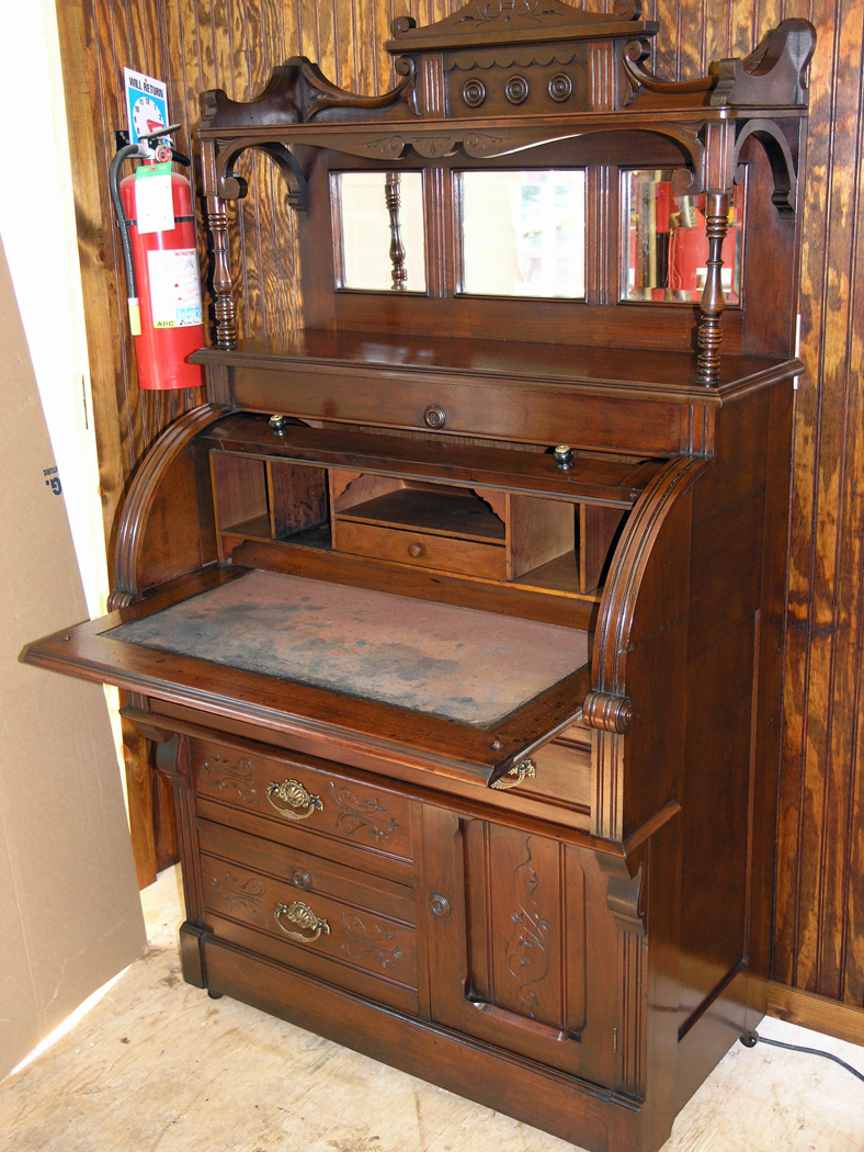 Restored cylinder desk with felt writing surface pulled out