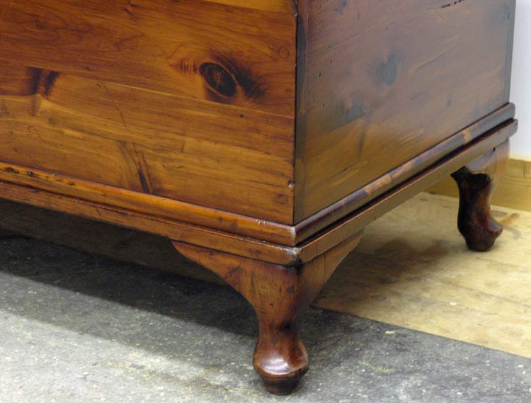 Cabriole feet on cedar chest after restoration