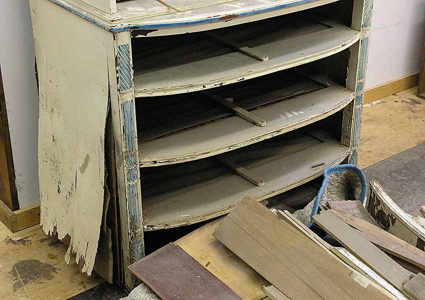 Dresser side with peeling veneer