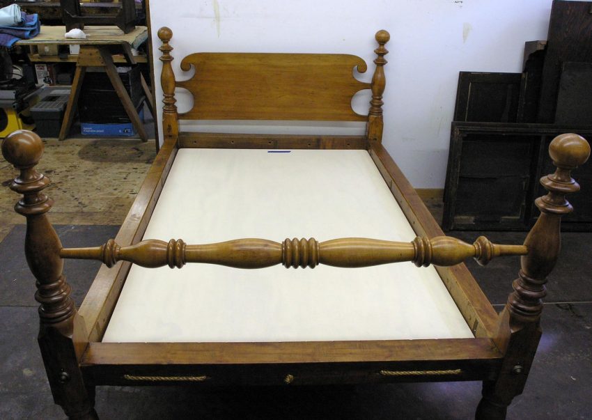 Antique cannonball bed with platform